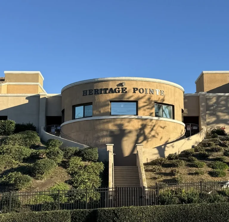 Commercial exterior rebranding & color change project at Heritage Pointe Senior Living by Southern Painting Inc.